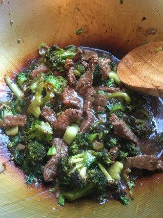 beef and broccoli stir fry in wok